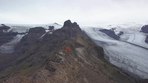 Hiker on the Top of a Mountain in Iceland