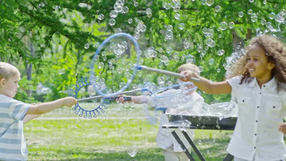 Adorable Kids Playing with Soap Bubbles in Park alt