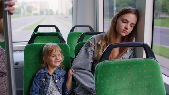 Exhausted Mother Fall Asleep and Missed Stop Station in Tram Kid Daughter Wakes Tired Sleepy Woman