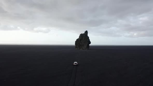 Aerial Shot of Scenic Sea Stacks in Iceland  Bright Wide Skies in Background