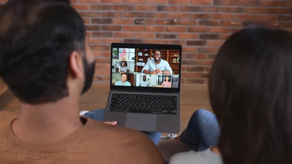 Indian Couple Using Laptop for Video Connection with Friends