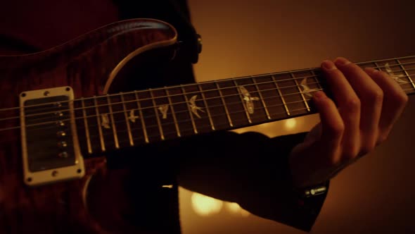 Guitarist Hands Playing Guitar on Stage Club Close Up