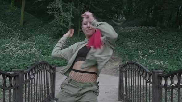 Young Woman Performing Modern Hip Hop Dance on Street. Hip-hop Moves.