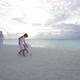Family of Six Walking at Sunset on the Beach - VideoHive Item for Sale