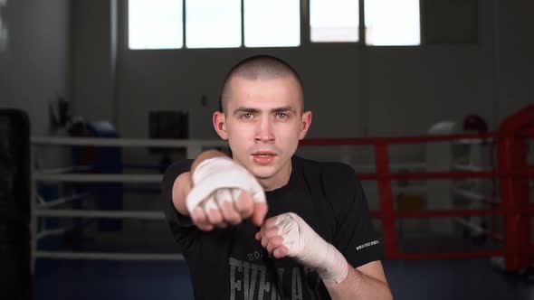 Portrait of a Boxer Working Out the Bumps in the Ring. Slow Motion.