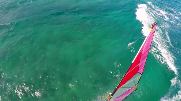 Aerial view of a man windsurfing in Hawaii