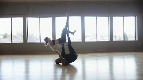 Partner Yoga performance done by two professional instructors