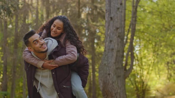 Happy Young Carefree Married Couple in Love on Romantic Date in Park in Nature Joyful Girl Sits on