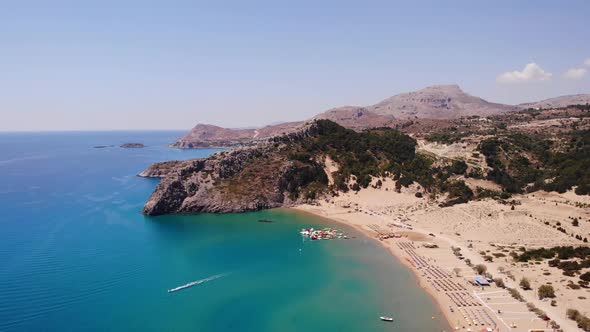 Idyllic Landscape Of Tsambika Beach In Rhodes, Greece - aerial drone shot