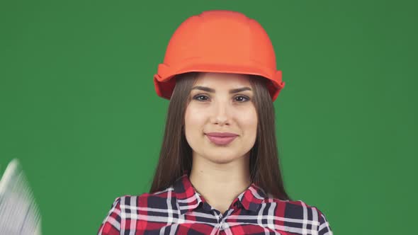 Beautiful Female Constructionist Smiling Wearing Hardhat