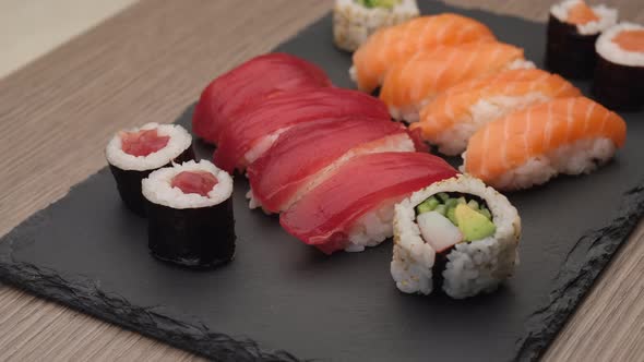 Sushi assortment with nigiri salmon, nigiri tuna, hosomaki and uramaki. Typical Asian food rotating