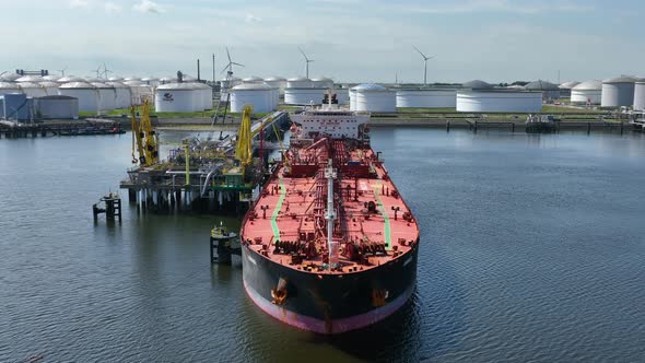 Crude Oil Liquid Cargo Transporter Ship Unloading Petrochemicals to a Fuel Depot