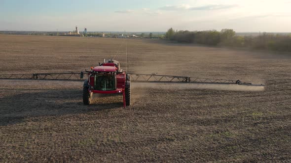 Aerial Footage of an Irrigation Machine Watering the Soil in the Field