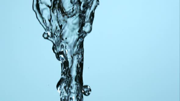 Water pouring and splashing in ultra slow motion 1500fps on a reflective surface - WATER POURS  alt
