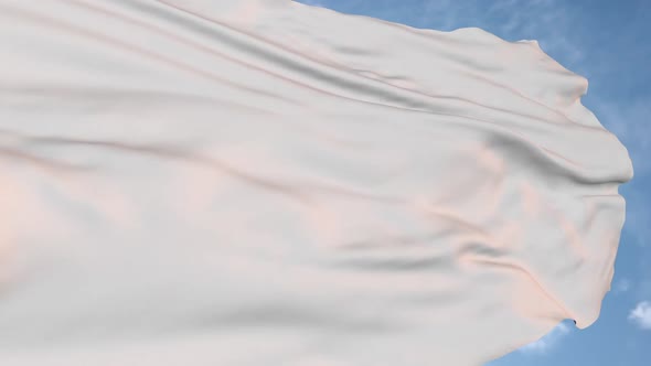 White flag on sky background