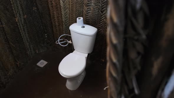Toilet in African Grass Hut Bathroom in Small Thatched House Zanzibar Village