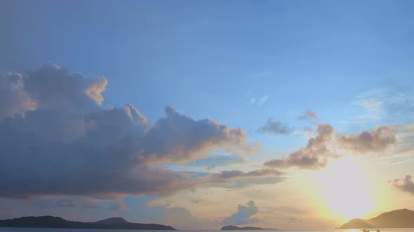 Sunrise In Blue Sky Above The Sea