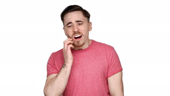 Portrait of Adult Sick Man Suffering From Toothache and Touching Jawbone with Pain on Face Over