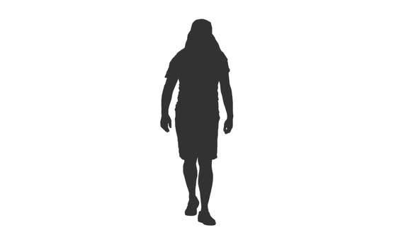 Silhouette of Adult Man Tourist Walking in Shorts and Arabic Head Wear alt