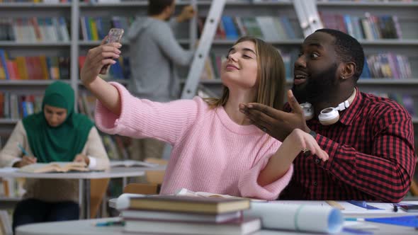 International Students Taking a Selfie in Library