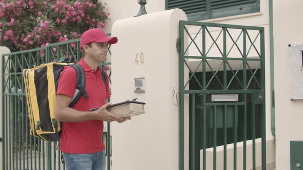 Courier Ringing Doorbell, Giving Package To Customer