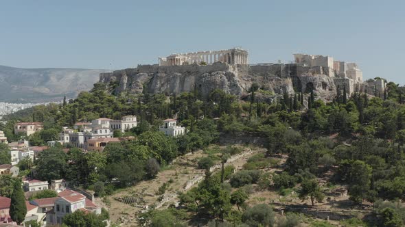 Slow Aerial Dolly Towards Mountain with Acropolis of Athens in Greece at Daylight