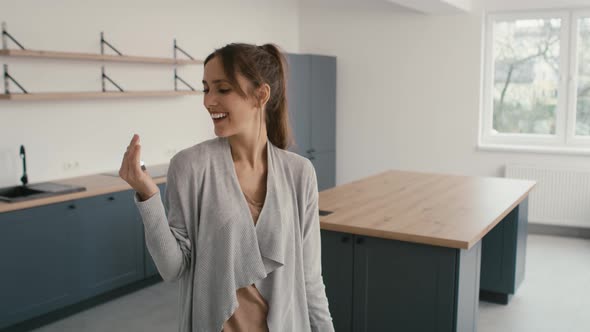 Happy caucasian woman holding a bunch of keys. Shot with RED helium camera in 8K