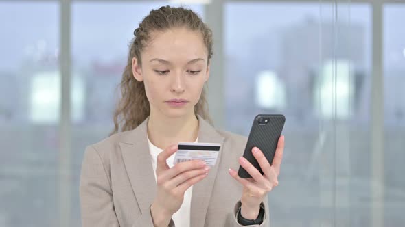 Portrait of Young Businesswoman Making Online Payment on Smartphone