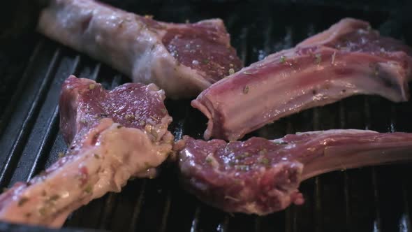 Still Raw Lamb Ribs in Spices are Grilled