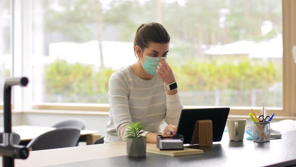 Woman in Mask Working on Tablet Pc at Home Office