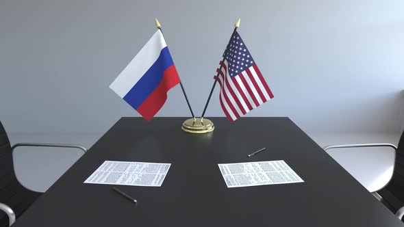 Flags of Russia and the United States on the Table alt