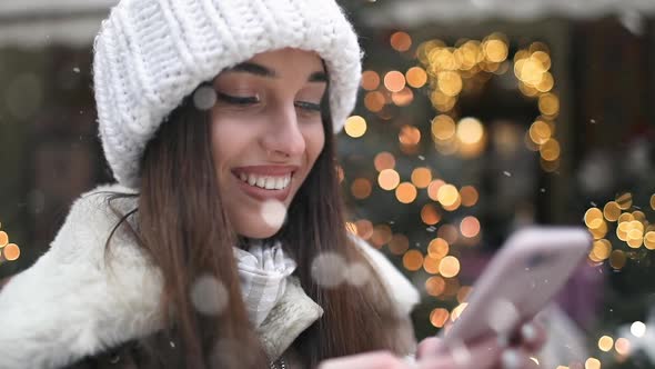 Girl Using Smartphone on the Street