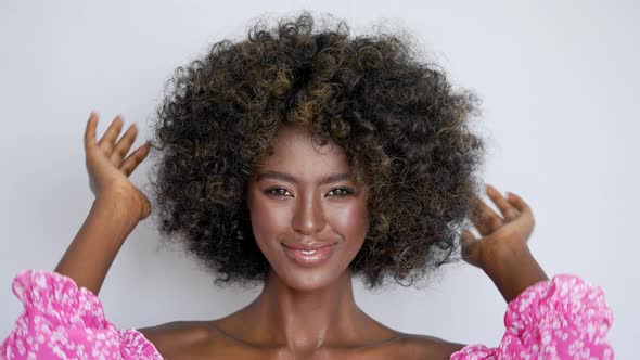 Smiling Black Woman with Curly Hair