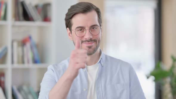 Portrait of Man in Glasses Showing Thumbs Up Sign