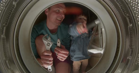 Dad Daughter Repairing Washing Machine He Uses Wrench Hands Demonstrates Pliers