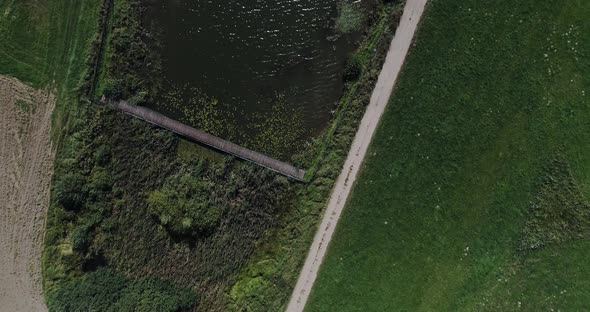 Aerial top down of Kashubian Lake Pomeranian Voivodeship Poland, drone reveal natural water lake for