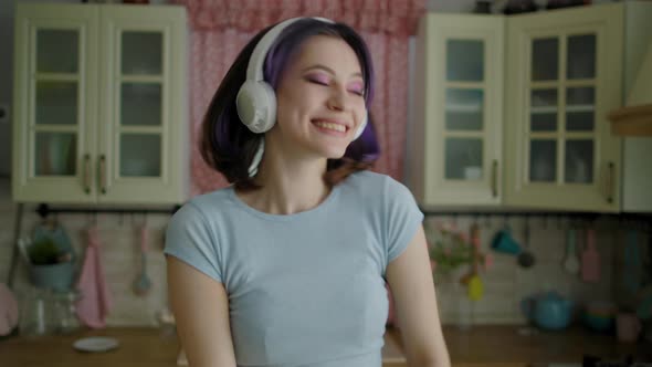 Young Beautiful Woman Dancing Kitchen At Home In Headphones