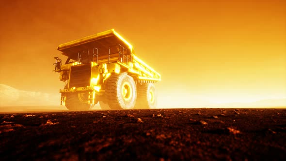 Big Yellow Mining Truck in the Dust at Career