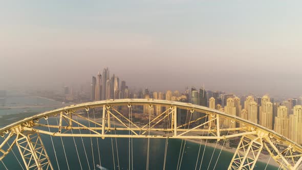 Aerial view passing by of the Ferris wheel under construction, Dubai.