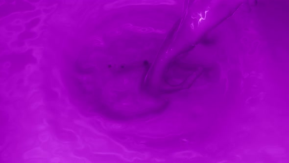 Pouring Purple Color Into Purple Color Swirl
