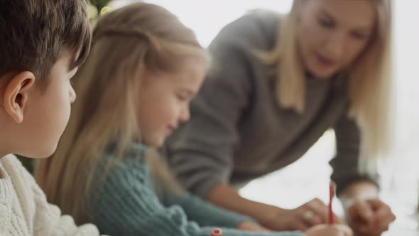 Video of children writing a letter to Santa Claus. Shot with RED helium camera in 8K.