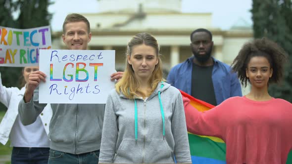 Activists Raising Posters and Rainbow Symbols, Rally March for LGBT Rights