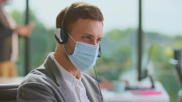 Male office worker using headset