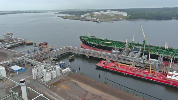 Aerial View Tanker Ship Unloading in Port of Logistic Import Export Business