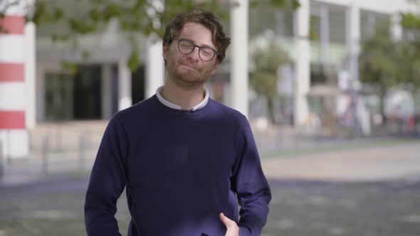 Emotional Man Talking and Looking at Camera Outdoor