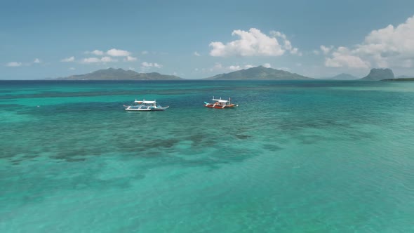 Turquoise Sea Water with Two Yacht Boats Aerial