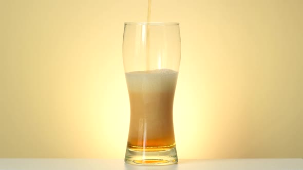 Beer Pouring Into Glass