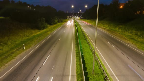 Busy night highway, tilt time lapse