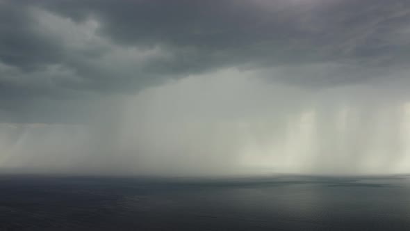 Aerial View Footage of Rain Clouds Over Sea Ocean Black Clouds in Bad Weather Day Over Sea Surface