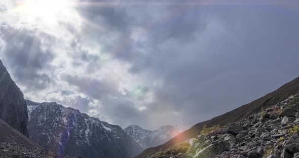 Timelapse of Epic Clouds in Mountain Valley at Summer or Autumn Time. Wild Endless Nature and Snow